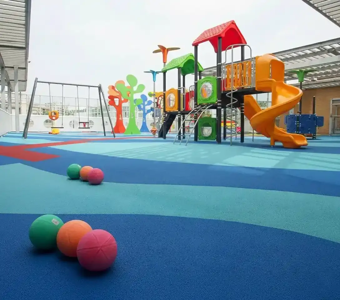 Playground with blue and green poured rubber flooring